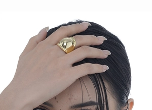 Polished gold wide dome ring shown on hand with high-gloss mirror finish and modern style