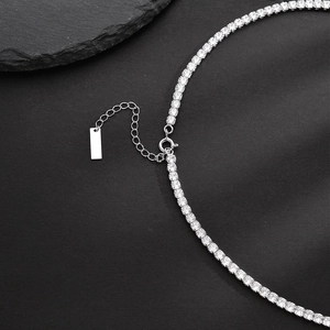 S925 sterling silver tennis necklace with sparkling cubic zirconia on dark stone background