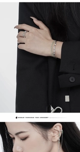 Detail of silver bamboo textured ring and green aventurine bead bracelet set