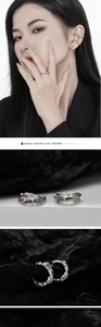 Detailed view of S925 sterling silver ear cuffs with irregular lava texture and coral blue enamel