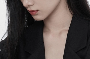 Close-up of black notch lapel blazer featuring premium high-density twill fabric texture