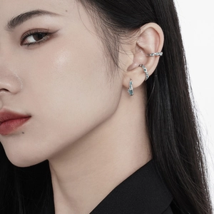 Minimalist S925 sterling silver ear cuff set with deep sea blue resin on female model