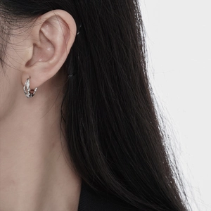 Minimalist S925 silver hoop earrings with irregular lava texture for a modern look