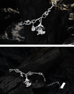 Close-up of S925 silver ghost charm bracelet with wizard hat and teardrop zircon