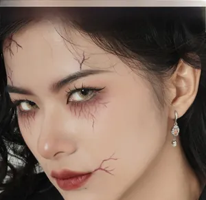 Close-up of S925 sterling silver ghost heart earring with pearl on gothic makeup model