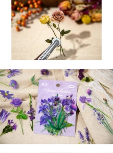 Close-up of vintage purple flower PET stickers for DIY scrapbooking and journal decoration
