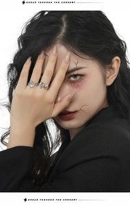 Close-up of S925 silver ghost rings with turquoise enamel on model with artistic makeup