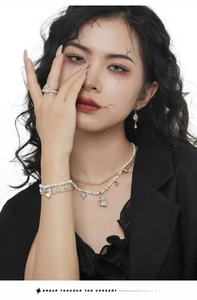Ghost pearl necklace with colored zircon and goth elements worn by a model