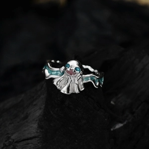 Ghost devil ring in 925 sterling silver with blue enamel wings on black rock background