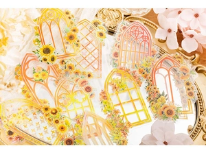 Detail of vintage gothic window stickers with flowers on a golden tray background