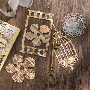 Vintage scrapbooking papierset in industriële stijl met tandwiel- en kaartontwerpen