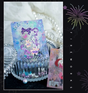 Macro detail of laser holographic PET stickers featuring ballet bear and fireworks designs
