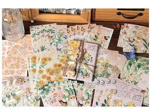 Detailed view of vintage flower stickers with torn edges on a rustic wood drawer