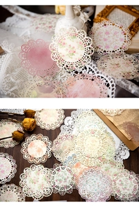 Detailed shot of vintage lace paper doilies with floral patterns for scrapbooking decor