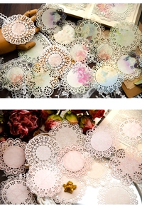 Macro shot of circular vintage hollow lace paper decorations with intricate floral cutouts