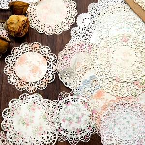Vintage floral lace paper doilies for journaling and table decor in beige and pink