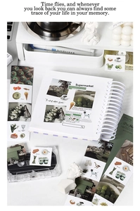 Detail showing lifestyle stickers and white spiral notebook for creative journaling