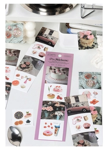 Macro view of 6-sheet aesthetic stickers featuring dessert, vintage car, and floral motifs