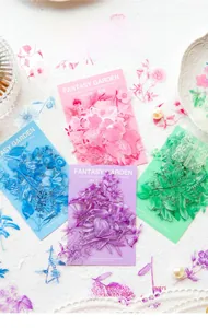 Detail of Twilight PET flower stickers with lace and pearl decor on a textured surface
