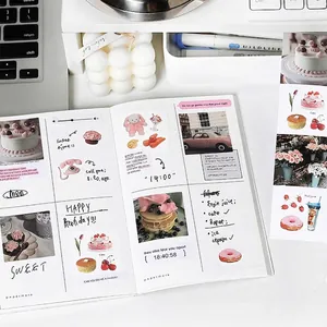 Aesthetic stationery set with scrapbook stickers and notebook on a cozy white desk setup