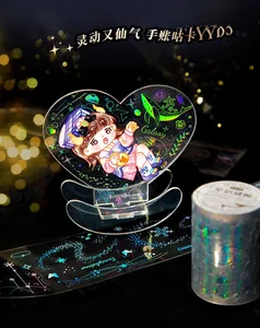 Macro view of laser laser-etched PET tape and acrylic galaxy stand with bokeh lighting