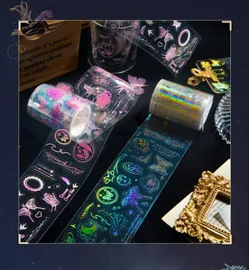 Macro view of laser PET tape with rainbow gold foil butterfly and star motifs