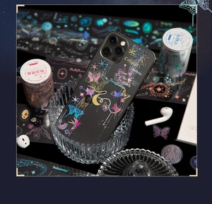 Detailed macro of laser holographic PET stickers with butterfly and moon motifs