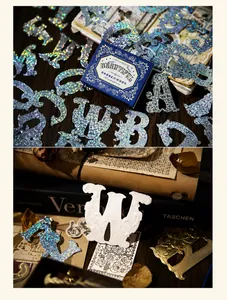 Macro detail of vintage gold foil alphabet stickers for scrapbooking and journal decor