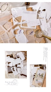 Gros plan de papier scrapbooking vintage évidé avec motifs plume, fleur et papillon