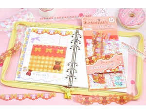 Close-up of cute bear theme lace stickers with yellow zipper bag for journaling