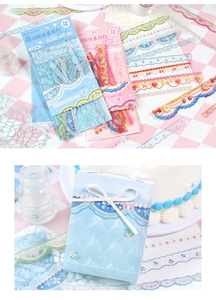 Detail of vintage lace and floral decorative stickers applied on a gift package