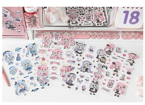 Detail view of cute anime girl journal stickers with pastel heart and gaming elements