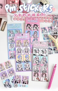 Close-up of anime girl decorative stickers with pastel stationery props for scrapbooking
