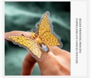 Detailed relief printing of golden butterfly stickers with a concave convex texture
