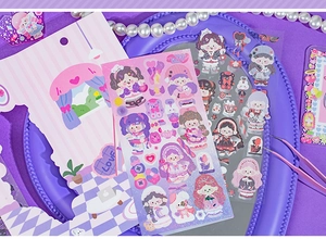 Macro view of cute girl stickers with purple laser finish and heart DIY decorations