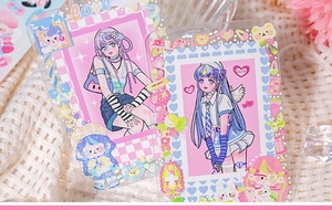 Detail of sweet pink DIY sticker decorations on transparent card holder for scrapbooking