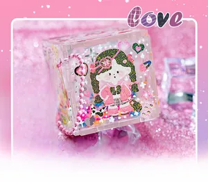 Detail of transparent acrylic Guka storage box with cute anime girl print and pink bead chain