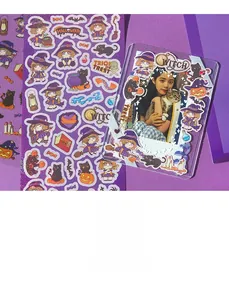 Detail of purple Halloween witch stickers and a card holder for scrapbooking