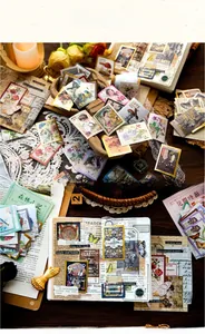 Detailed view of vintage scrapbook stickers featuring floral, butterfly and stamp designs