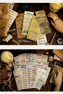 Macro view of vintage paper stickers and scrapbook materials on a dark wooden background
