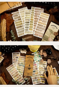 Macro view of vintage style scrapbooking stickers with music sheets and ancient maps