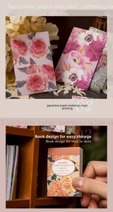 Nahaufnahme von Vintage-Blumenaufklebern und Washi-Papierbuch für Scrapbook-Dekoration