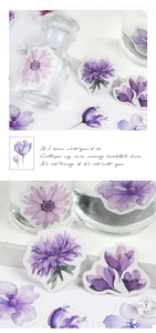 Macro detail of watercolor purple floral stickers showing hydrangea and dahlia designs