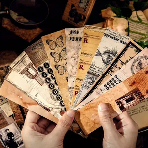 Vintage junk journal bookmarks with butterfly and retro elements held in hands