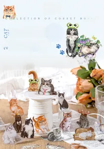 Close-up of cute PET cat stickers from the Pet Book series on a warm decorative background