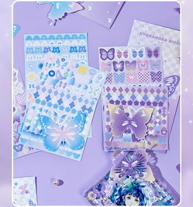 Close-up of pastel butterfly stickers with glitter details for journal decoration