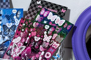 Detail of shimmering laser butterfly stickers for scrapbooking in a vintage Y2K style setting