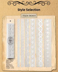 Dettaglio macro di adesivi in pizzo di cotone bianco per scrapbooking e decorazioni fai da te