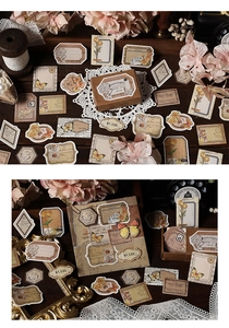 Detail of vintage scrapbooking stickers featuring butterflies and floral botanical motifs