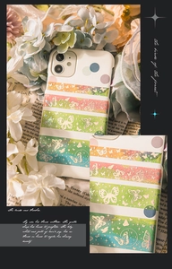 Detail of floral butterfly stickers on white phone case with soft lighting